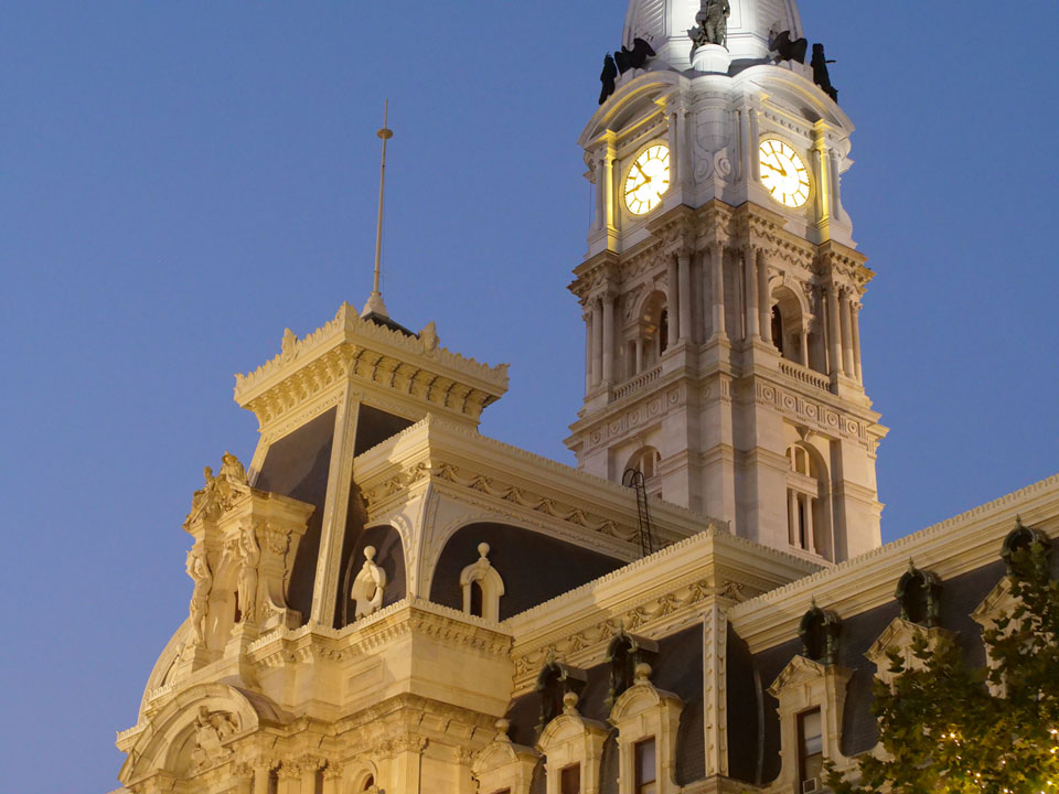 Philadelphia City Hall tower illuminated at dusk